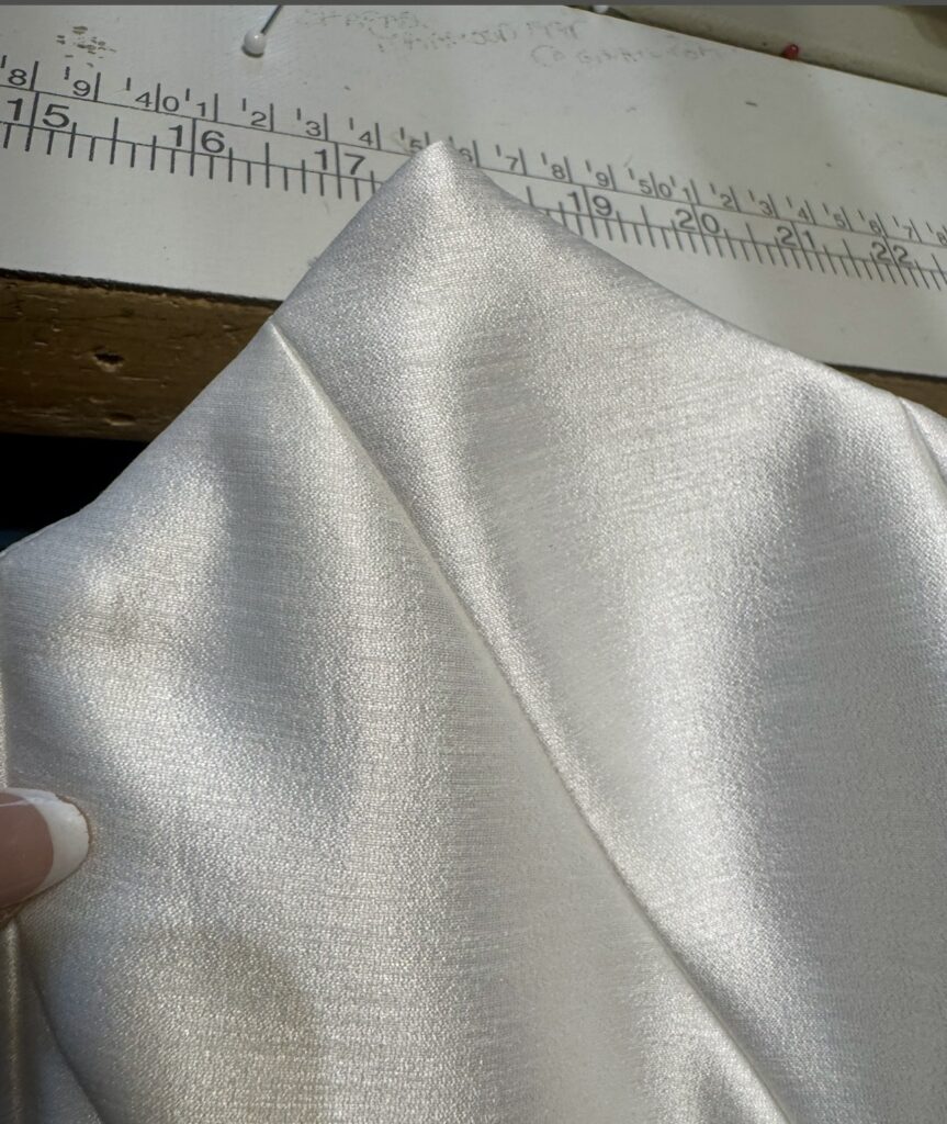 Internal boning added inside KYHA Studios Miles wedding dress during couture bridal alterations outside view after adjustment.