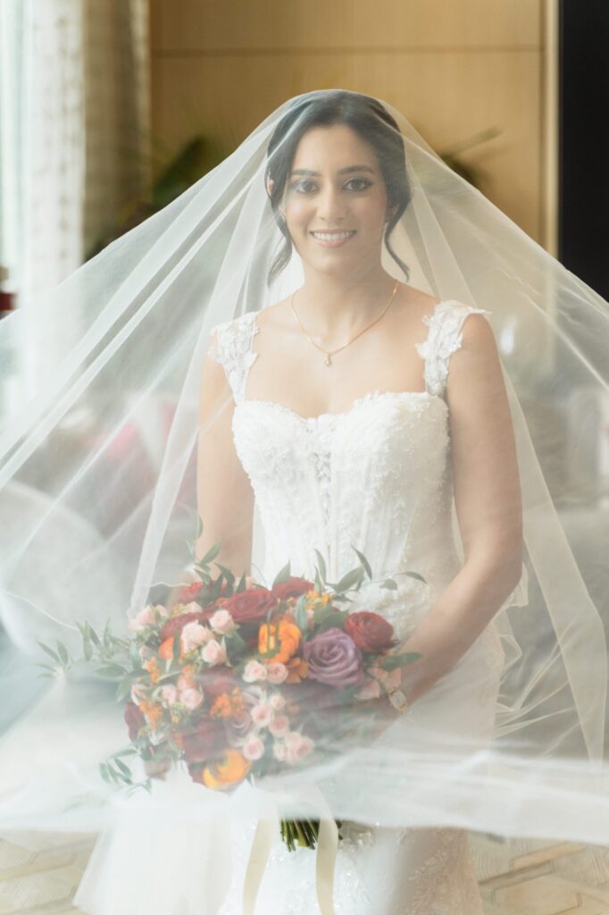 Maggie Sottero Benjie Royale wedding dress after couture alterations veil over face