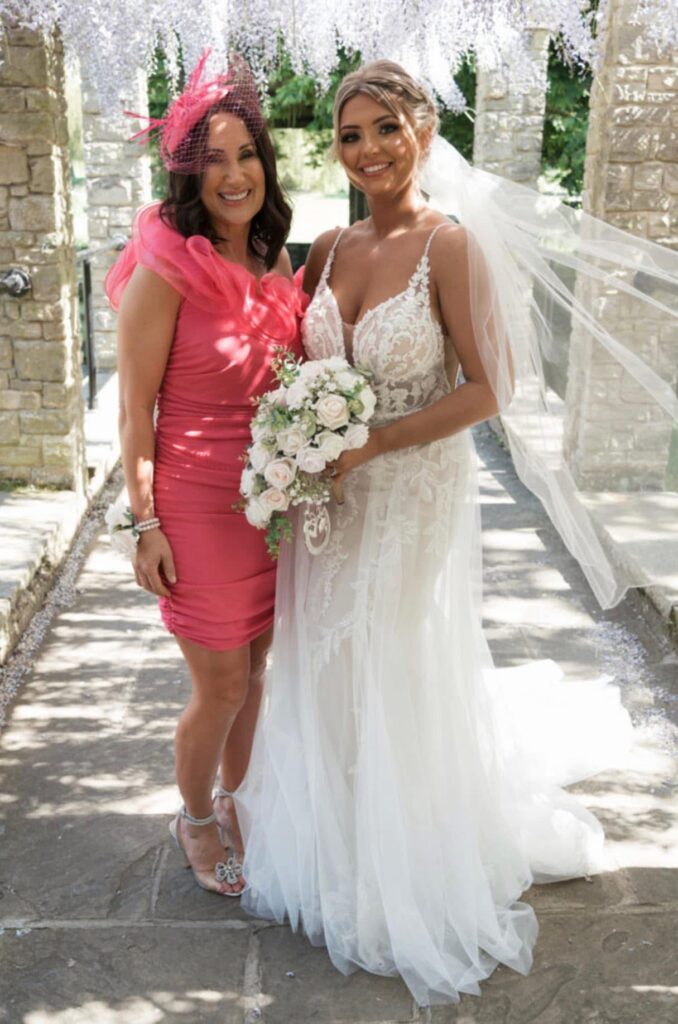 mum and bride all dressed on wedding day