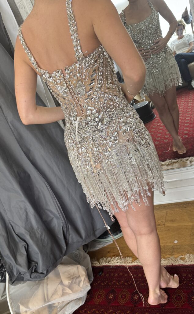 Back view of Albina Dyla crystal dress alterations showing shortened crystal straps and couture finishing.