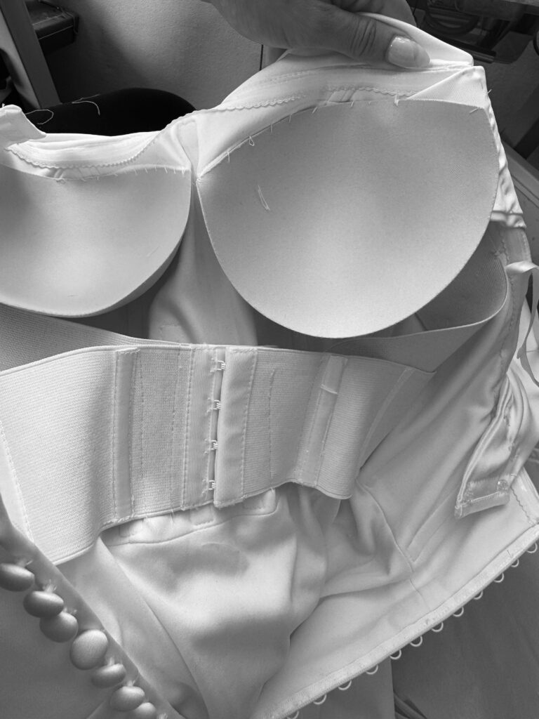 Hidden internal corset added for support inside an Allure wedding dress.