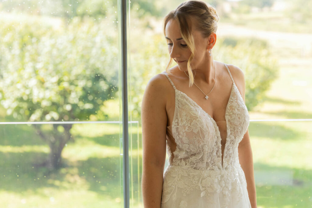 Bride wearing her altered Essense of Australia wedding dress following Kenley wedding dress alterations showing bodice fitting