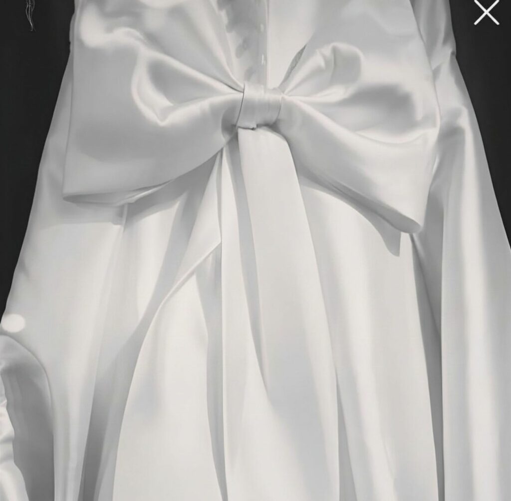 Handmade bespoke Mikado bow created during a couture wedding dress alteration.