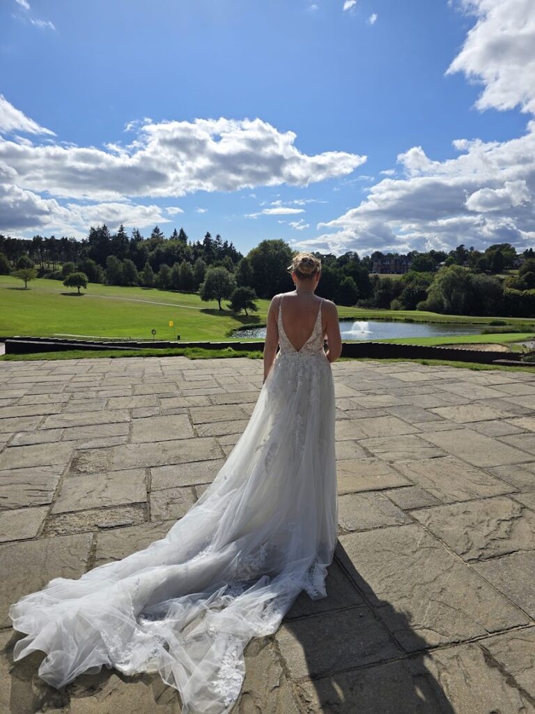 Bride wearing her altered Essense of Australia wedding dress following Kenley wedding dress alterations back detail.