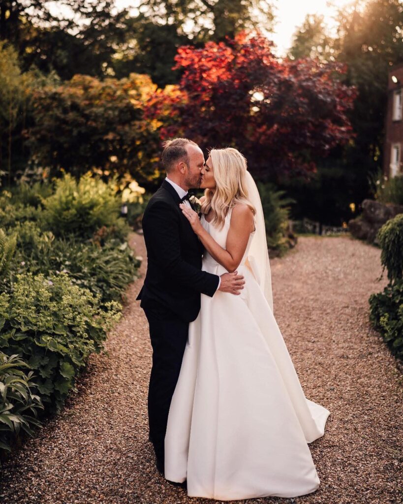 Rear view of a Stella York designer dress with a couture bustle and bespoke bow.