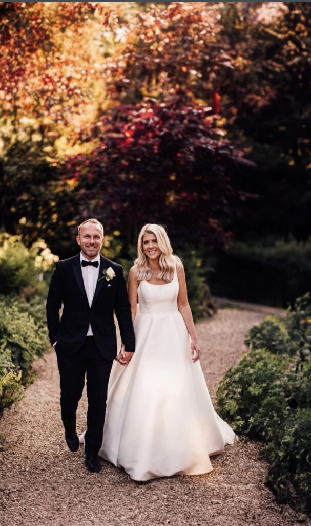 Bride wearing a beautifully fitted Stella York Mikado wedding dress after couture alterations.