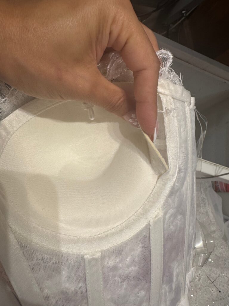Inside bodice of a Ricca Sposa Como wedding dress before expert cup reduction