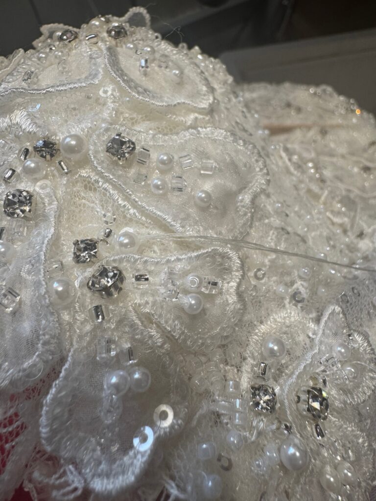handsewn details on the bodice and aroubd cup and hem 