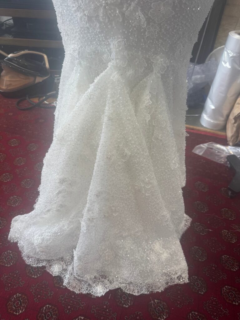 Three point American bustle lifting the train of a Ricca Sposa Como wedding dress