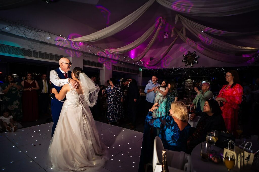 Autumn wedding featuring a bride from Essex wearing her altered WED2B Marianna gown dancing showing one point american bustle