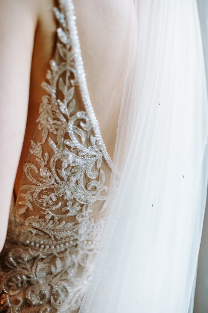 Heavily beaded Essense of Australia wedding dress fitted through the bodice and waist
