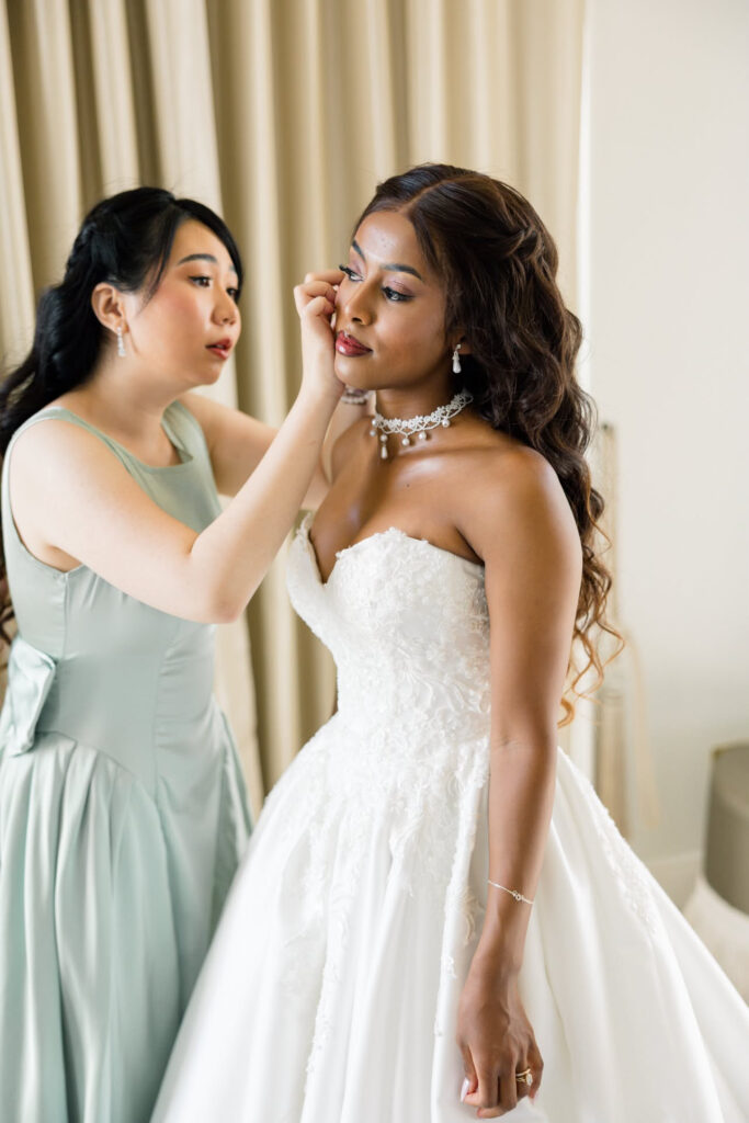 Uxbridge Bridal Alterations bride wearing her wedding dress showing a close up of the redesigned bodice.