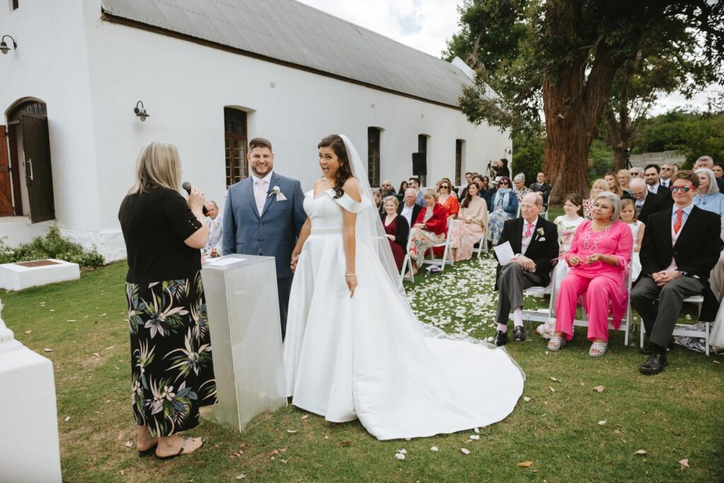 ceremony bride and groom Wandsworth bridal alterations for a Essense of Australia wedding dress reduced by four sizes, hemmed, bustled and pearl belt embellished.