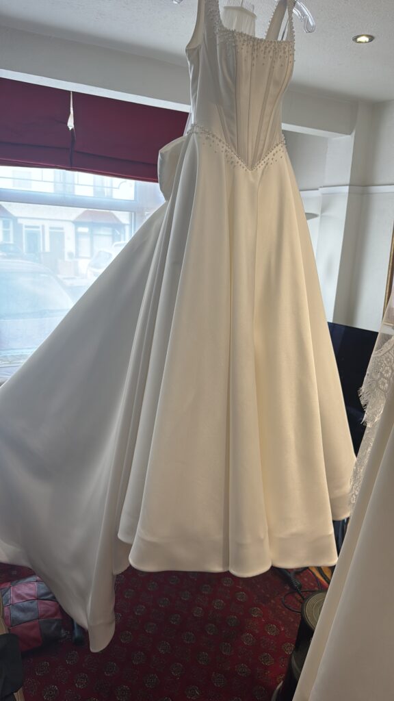 final pressing of Bridal dress mother of bride.