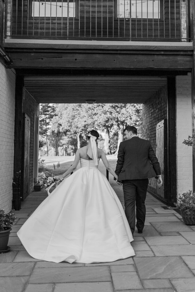 Pregnancy Wedding Dress Alterations New Malden bride wearing the satin reception gown at the final fitting