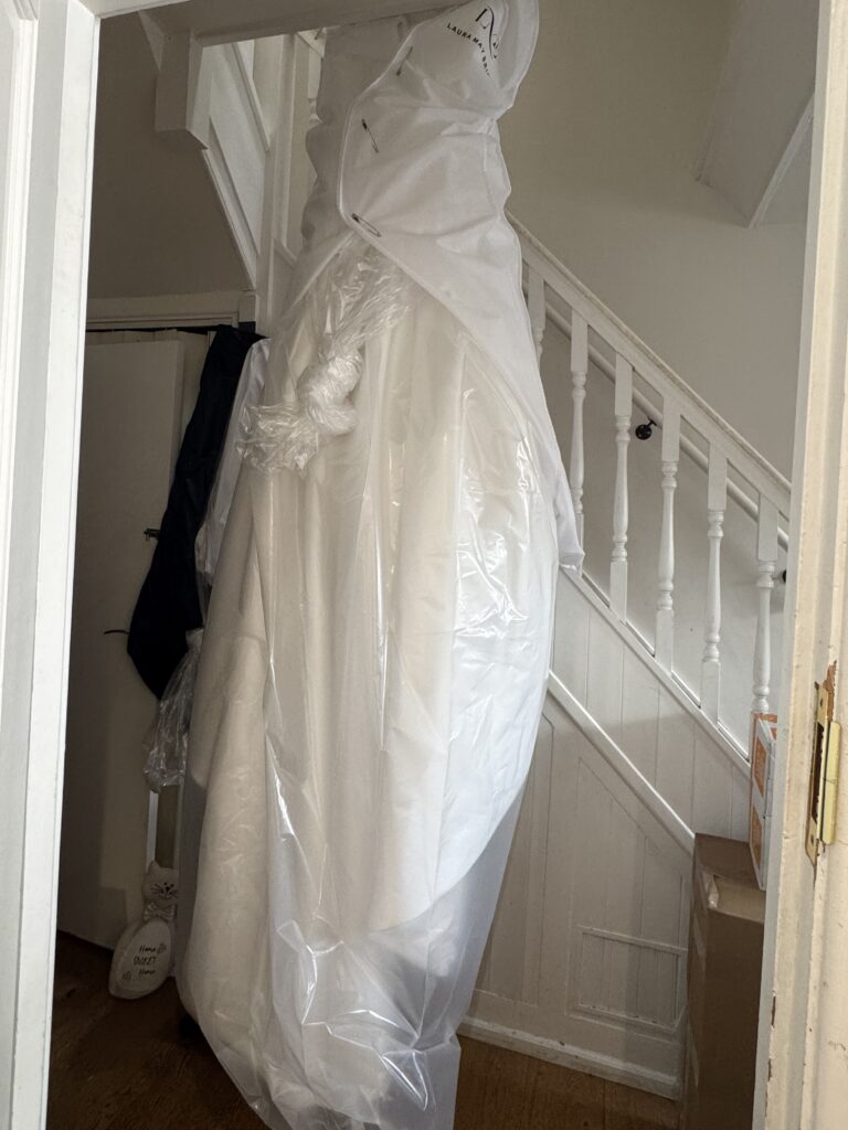 Stella York wedding dress packaged for travel after being comprehensively steam pressed.