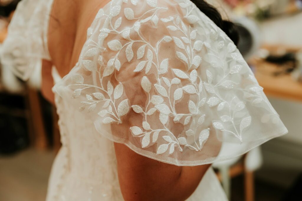 Wedding Dress Alterations Leatherhead flutter sleeves complete on brides ceremony.
