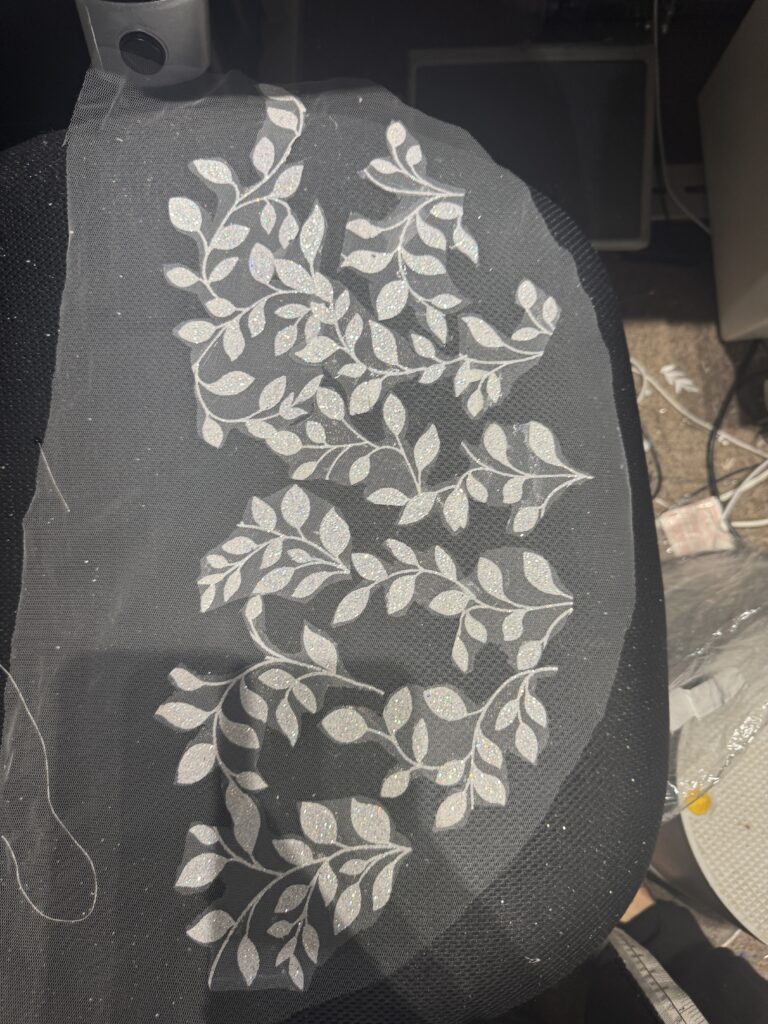sleeves being glued with fabric remnants.