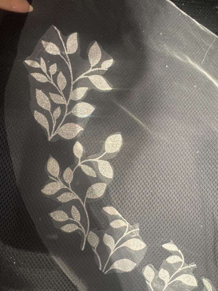 Adding sleeves to a wedding dress with bespoke bridal sleeves created from the original glitter leaf pattern gown 
