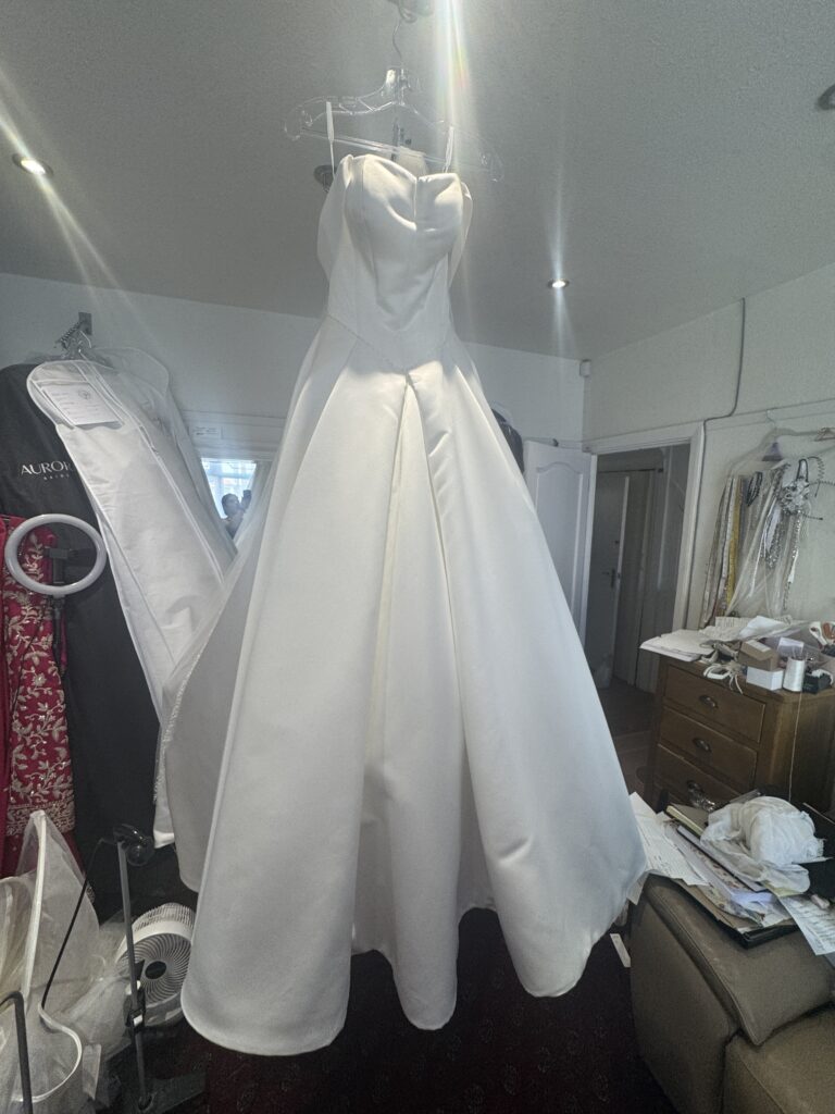 steam pressed bridal dress and cathedral veil ready to collect.