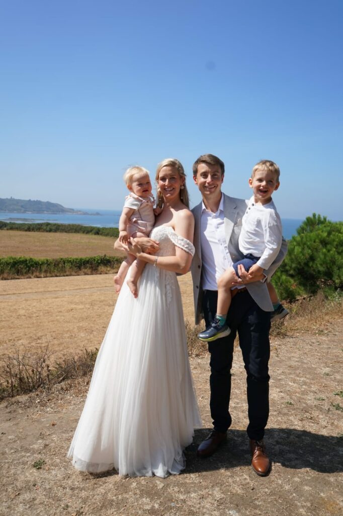 Bride and groom with family.