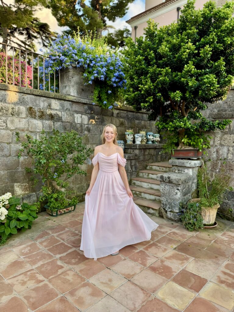 Bridesmaid dress alterations on a blush pink chiffon gown for a destination wedding in Italy