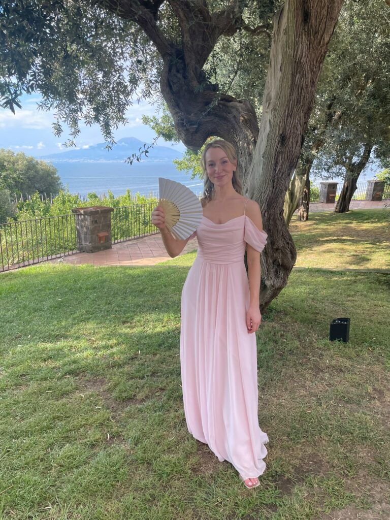 Bridesmaid dress alterations on a blush pink chiffon gown for a destination wedding in Italy by a degree qualified fashion designer.