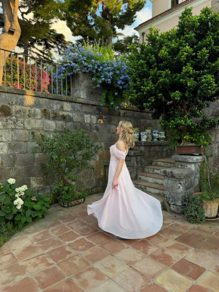 Bridesmaid dress alterations on a blush pink chiffon gown for a destination wedding in Italy by a couture trained seamstress.