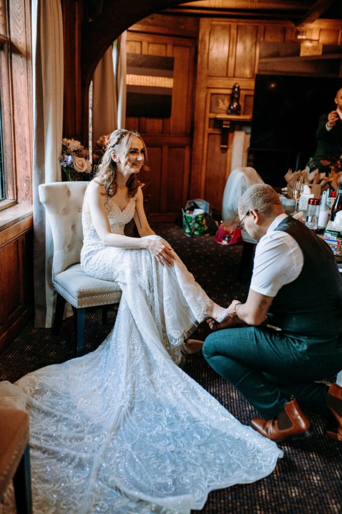 Heavily beaded Essense of Australia wedding dress fitted through the bodice and waist Walton on the Hill Wedding dress transformation.