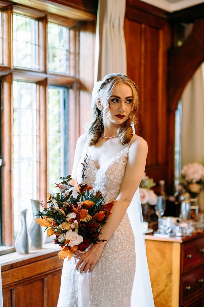 Beautiful silhouette of fitted Essense of Australia wedding dress with embellished train