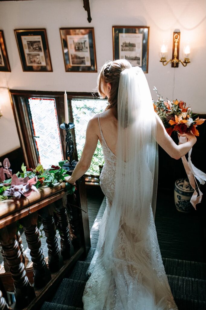 perfectly fitted essense of Australia dress on a bride to fit her body like a glove.