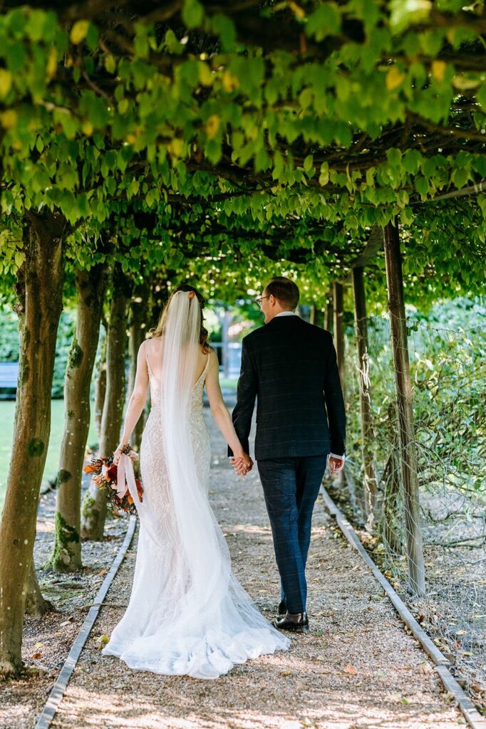 Rear silhouette of fitted Essense of Australia wedding dress with embellished train