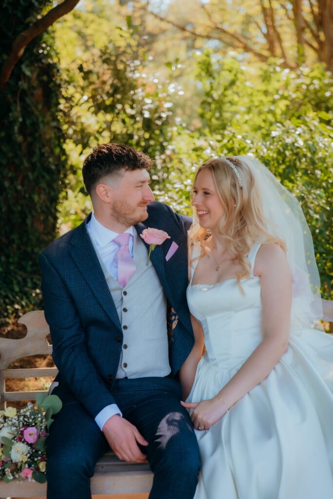 Bride wearing House of CB wedding dress after bust and waist alterations perfectly fitted like a glove.