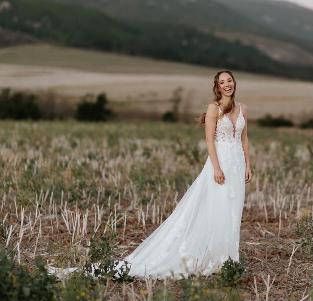 Full-length view of Kelly's lace gown after bridal alterations perfectly fitted like a glove.