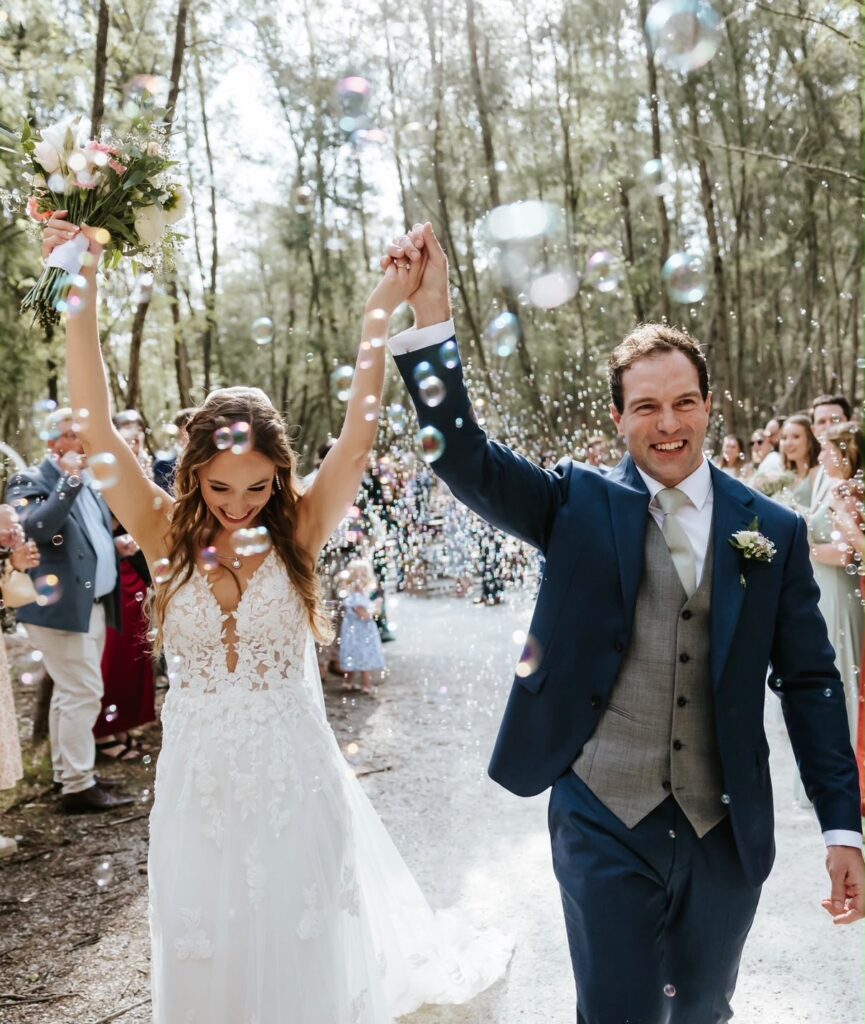 Kelly wearing her fitted lace wedding dress during the wedding celebrations