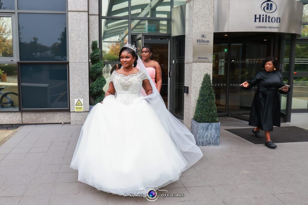 Coulsdon bride on wedding day wearing bespoke altered Morilee wedding dress