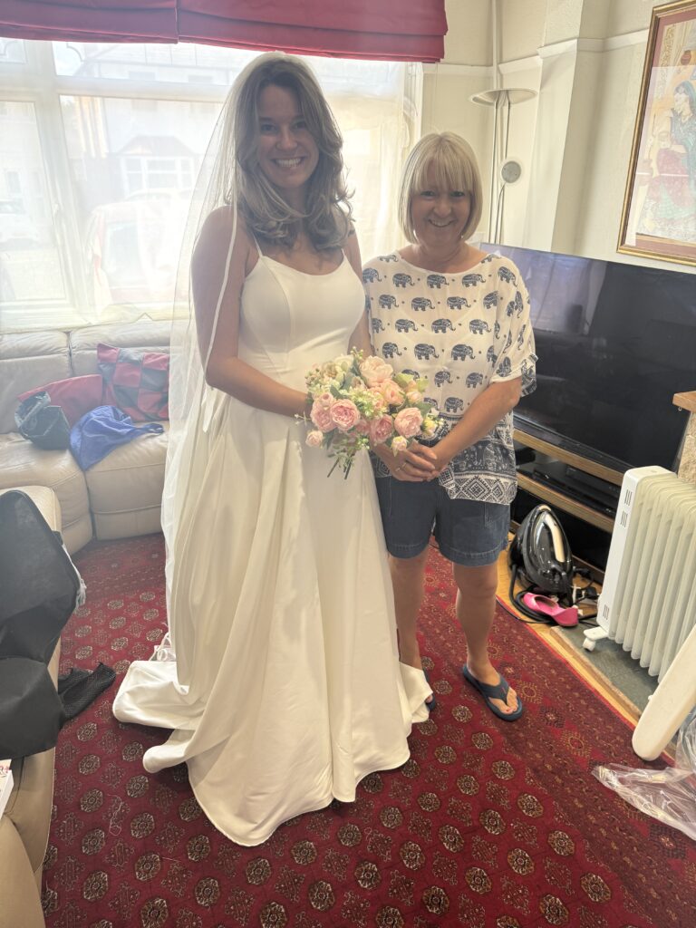 Pregnant bridal alterations Carshalton final fitting all happy in her dress.