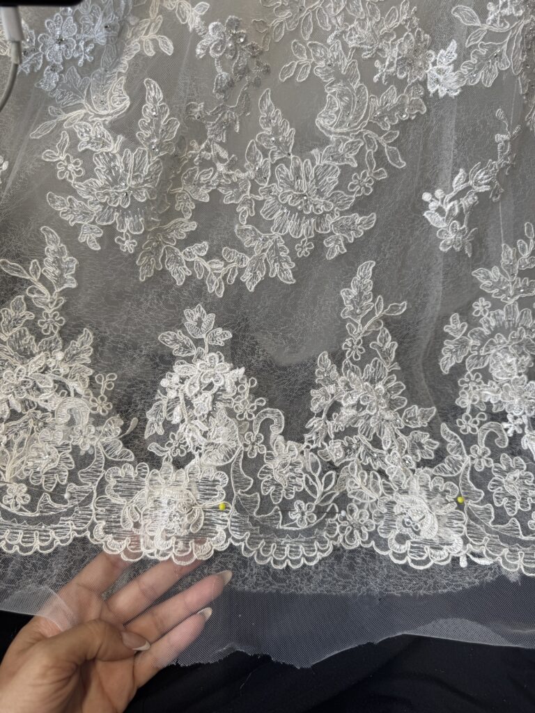 lace hem shortened to new length by completely unpicking and reattachment by hand.