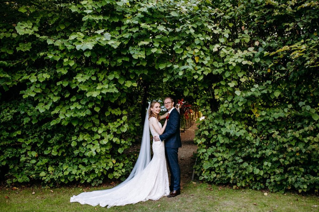Walton On the Hill bride wearing altered Essense of Australia wedding dress with groom