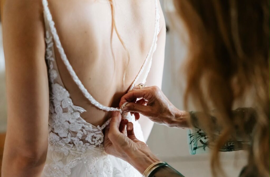 Close-up of the fitted low-back lace bodice after bridal alterations