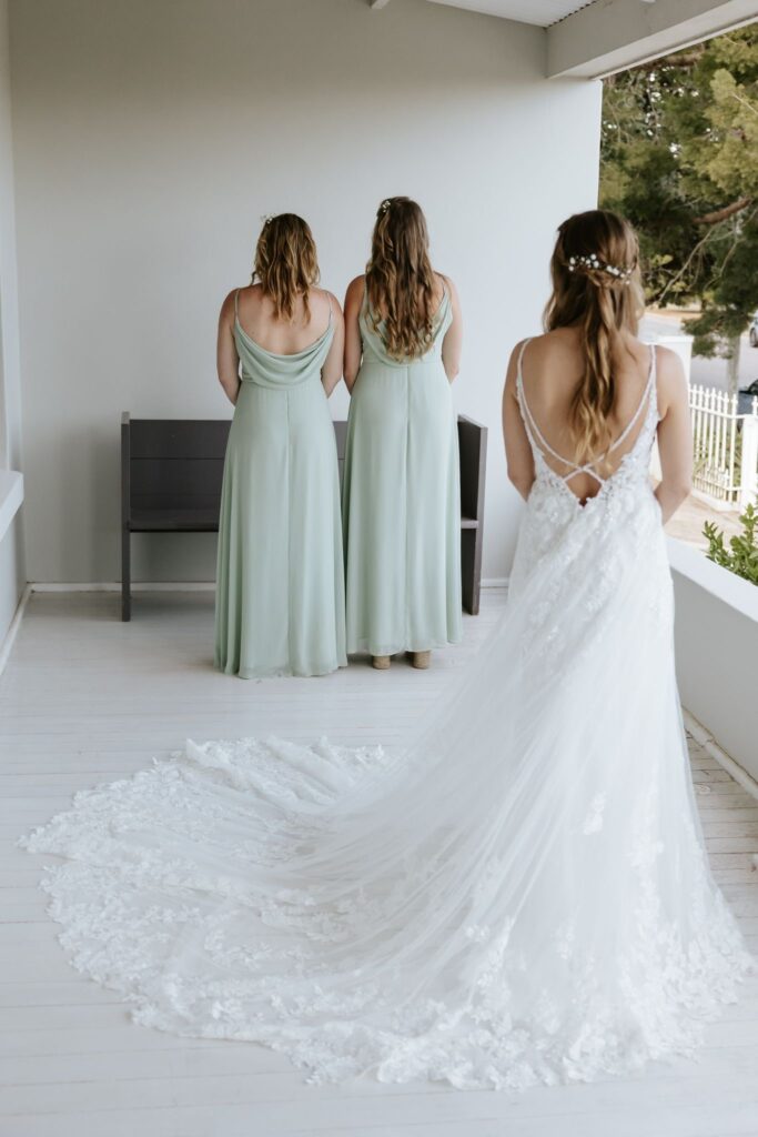 bridesmaid and bride back viee.