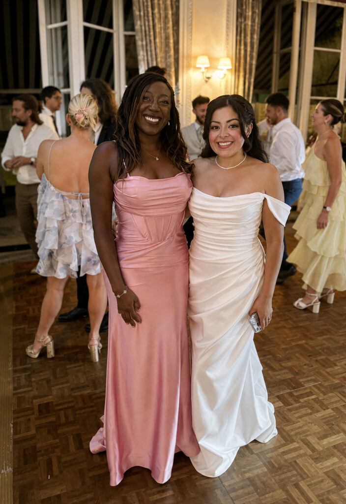 West Norwood bride wearing a Blue Willow by Anne Barge wedding gown after couture bridal alterations with her bridesmaid.