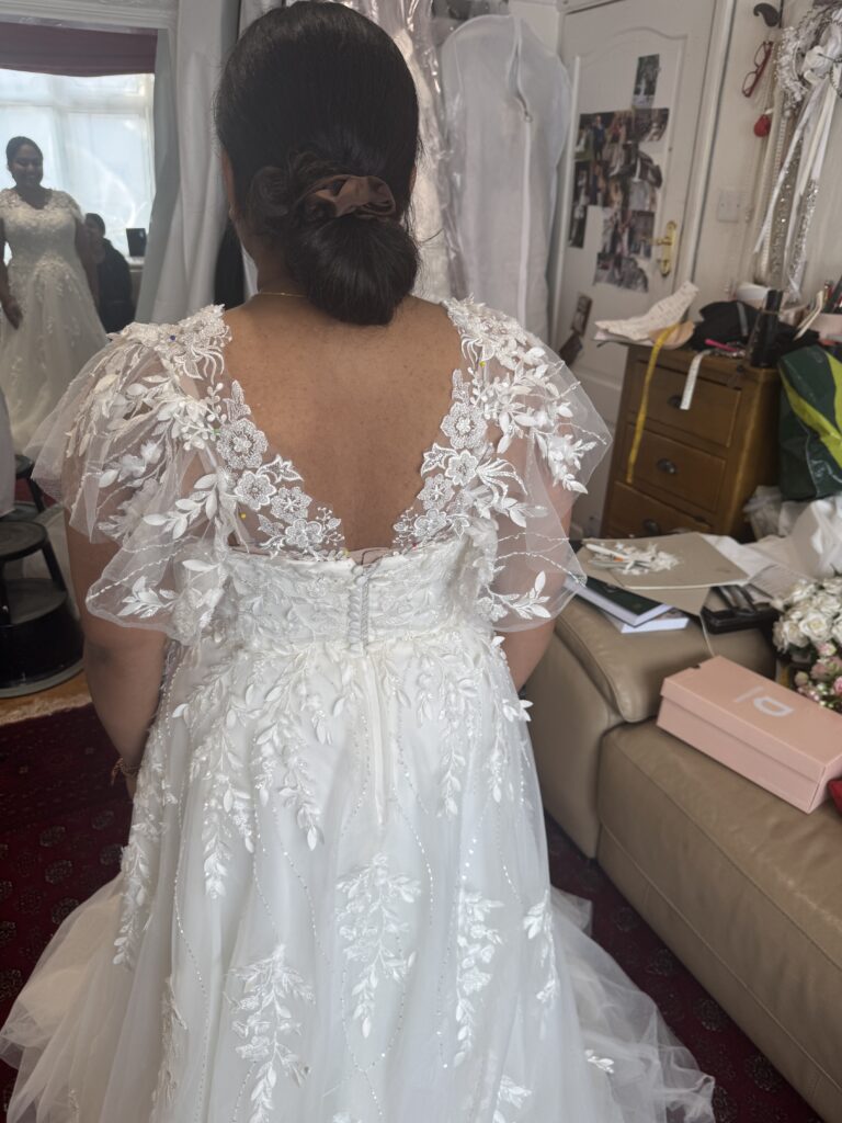 Hayes wedding dress alterations on an Essense of Australia D3529 gown with a redesigned back lace neckline and illusion shoulders after all alterations were finished.