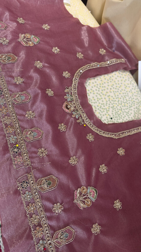 neckline construction on the fitted choli blouse.