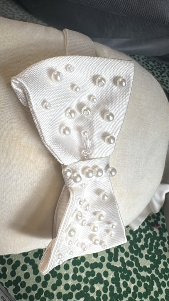 bow hand embroidered with pearls matching brides veil