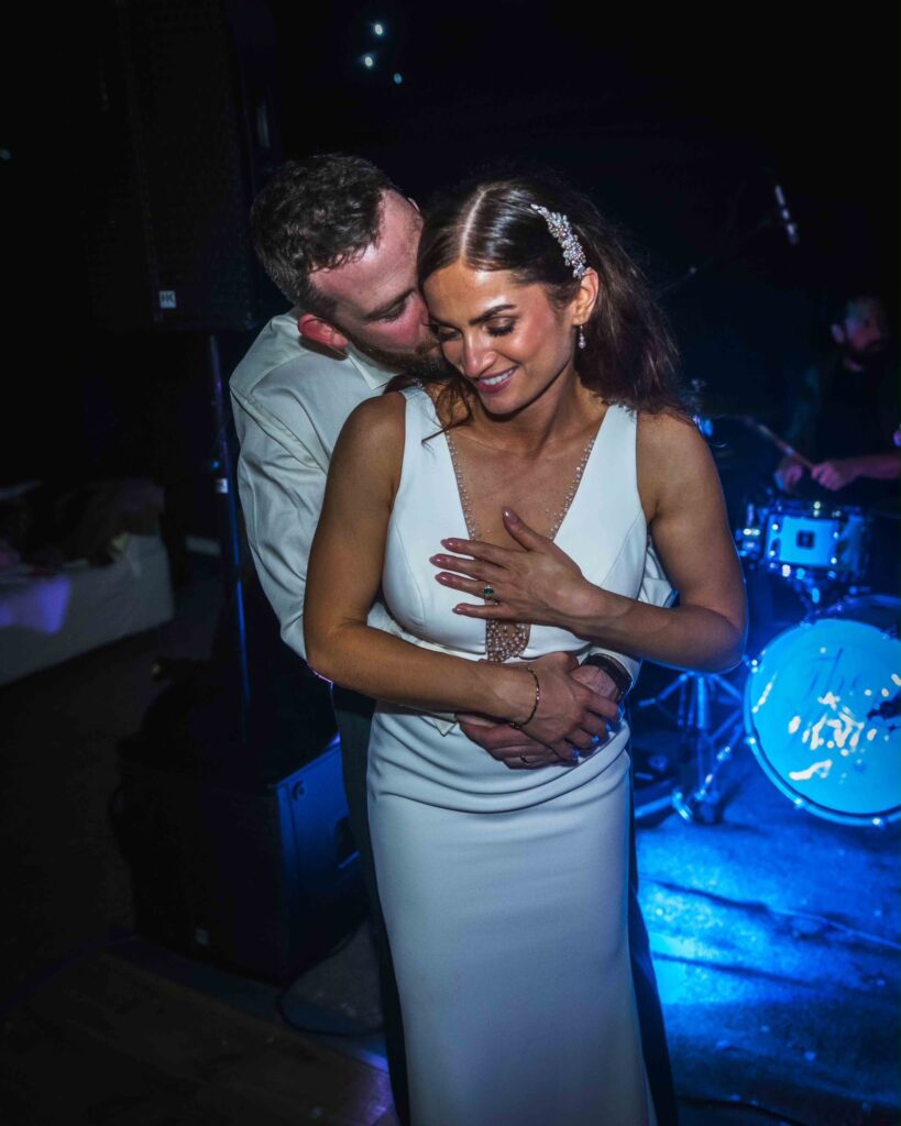 Dancing bride and groom during night celebrations Raynes Park couple.
