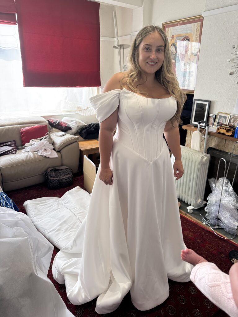 final fitting day of bride front view of the dress.