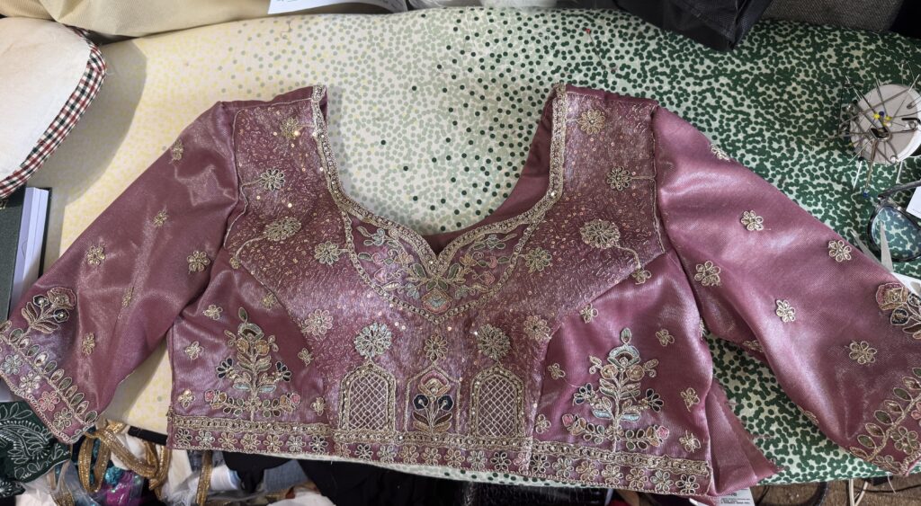complete choli with fitted sleeves and internal bust support.