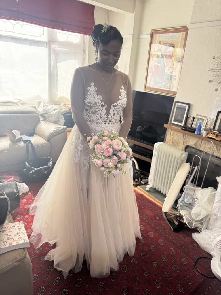 Orpington Bridal Alterations, hemmed to new length, sleeve adjustment and Five-point American bustle created, on a layered Berta Muse Nila wedding dress