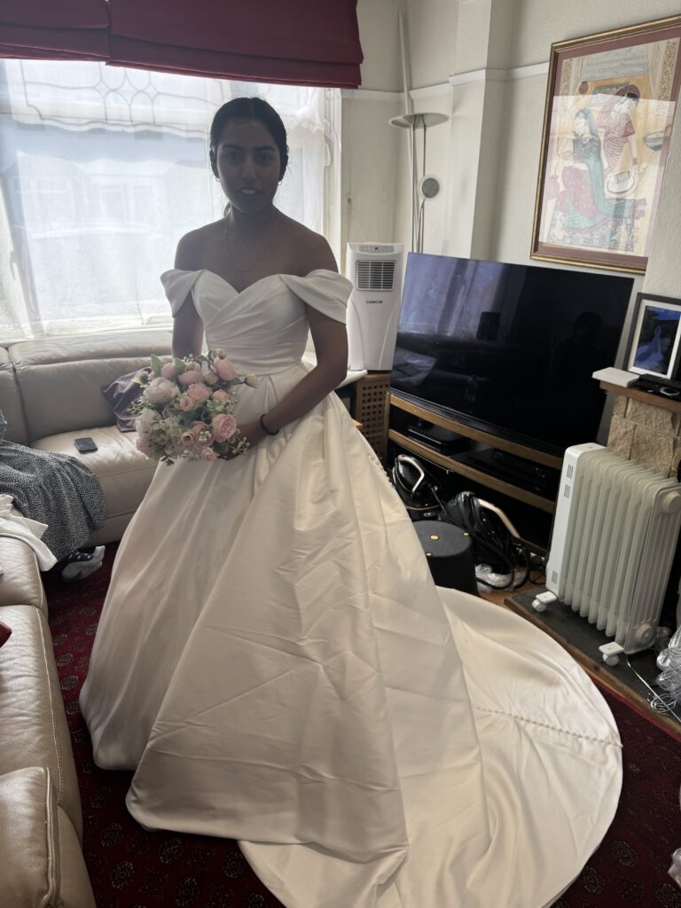 Bride wearing her WED2B Sofia Cruz Jade gown during a fitting in Sutton for Hayes and Pinner bridal alterations.
